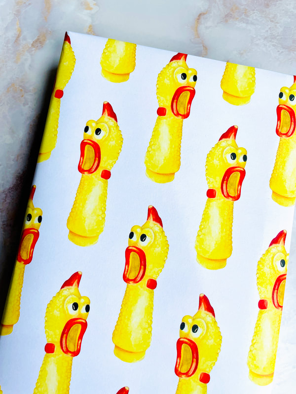 PLASTIC CHICKEN HEADS ON PAPER